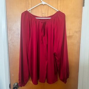 Red blouse, satin like material. No tag but fits like an xl